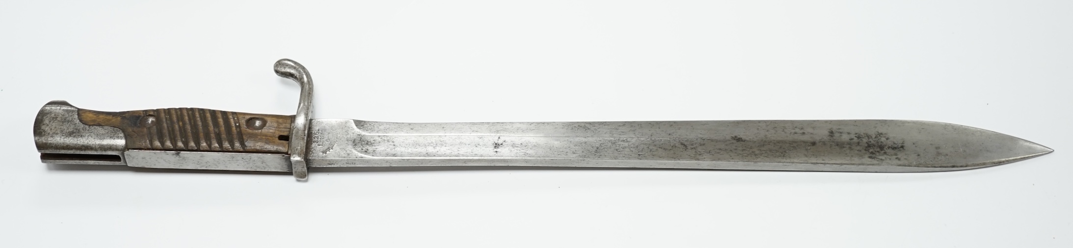 A WWI German Mauser bayonet with wooden grips. Condition - fair, some wear